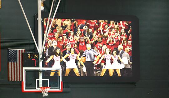 team being shown on a scoreboard screen